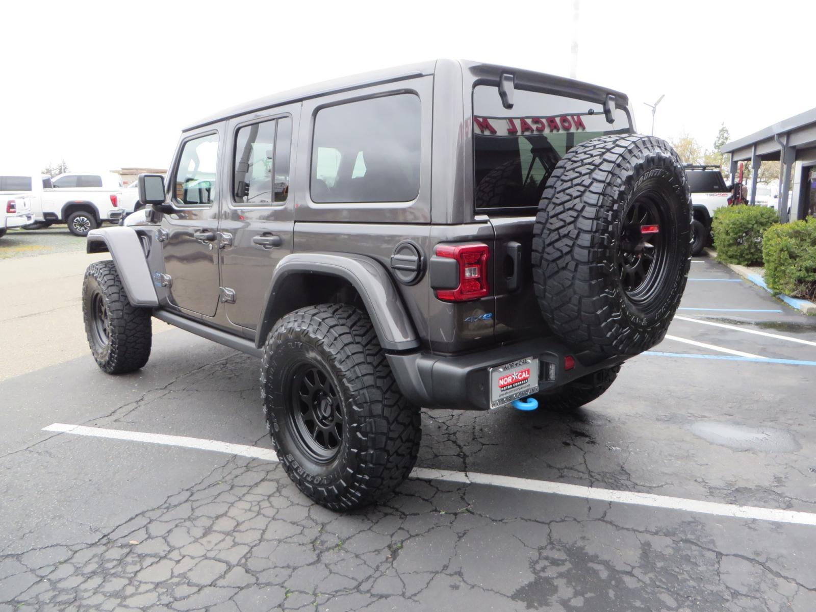 2021 CHARCOAL /BLACK Jeep Wrangler Unlimited Rubicon 4XE 4d SUV 4wd (1C4JJXR60MW) with an 2.0L L4 DOHC 16V TURBO engine, automatic transmission, located at 2630 Grass Valley Highway, Auburn, CA, 95603, (530) 508-5100, 38.937893, -121.095482 - 4XE Rubicon sitting on a Zone offroad suspension system, Fox shocks, 37" Toyo RT trail tires, 17" Method Race wheels, Teraflex Hd tire carrier, and Flat tow ready. - Photo #6